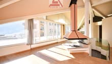 large windows, fireplace, wooden floor, spacious layout, city view