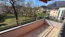tiled floor, metal railing, view of the mountains and trees
