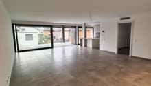 spacious open room, tile flooring, large windows, balcony