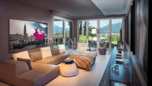 Spacious living room with large windows offering a scenic view of the mountains, modern furniture including a beige sectional sofa, a glass coffee table, and decorative accents such as a pink rabbit sculpture and a wall art piece depicting a cityscape.