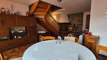 table, chairs, fireplace, cabinets, shelves, staircase
