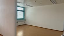 empty office room, windows, wooden floor, radiator