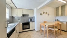 wooden cabinets, granite countertops, built-in microwave, electric oven, dishwasher, dining table, chairs, sink, faucet