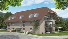 2 story house, brown roof, beige walls, large windows, balconies, parking area, garden, trees