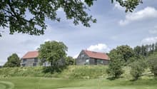2 houses on hill, red roofs, modern design, green surroundings, golf course