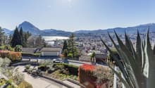 House with garage, driveway, garden, view of mountains and city