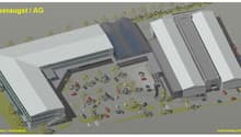 2 buildings with several parking spaces in the middle