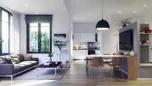 Spacious open-plan living area with large windows, modern gray sofa, wooden dining table and chairs, kitchen with white cabinets, and a black pendant light fixture.