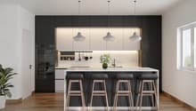 modern kitchen, black cabinets, white countertops, four bar stools, under-mount sink, oven, flower vase, plant