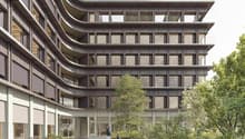 modern architecture, concrete, large windows, parking area with bicycles, greenery