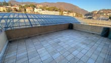 tiled floor, glass canopy, view of the city