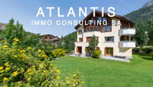 2 story house, wooden exterior, beige walls, large windows, balcony, garden, mountain view