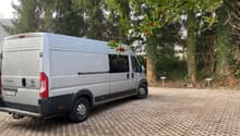 white van parked on a paved parking lot