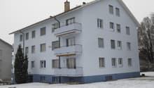 3 story white building, balcony, chimney, windows, snow
