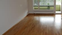 empty room, wooden floor, white walls, sliding glass doors, balcony