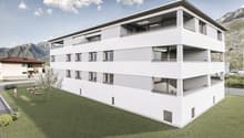 Modern multi-story building with white exterior, balconies, and a green lawn in front.