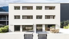 white modern house, large windows, multiple balconies, outdoor seating