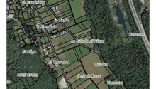 Topographical map with various labeled locations and a scale of 1:5000. It shows different land areas, bodies of water, and roads. The map includes a legend and references to the source of the data.