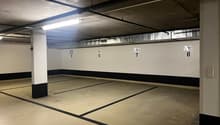 empty parking area, lights, number markings on the wall