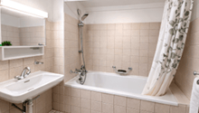 Bathroom with bathtub, sink, mirror, shower curtain, towel rack