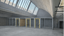 Parking garage, concrete walls, metal doors, grey flooring, large windows