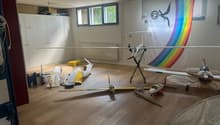 Wooden floor, aircrafts, boxes, cabinets, windows