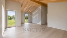 Grand séjour lumineux / an empty room with wooden floors, white walls and a large window