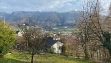 hillside garden with a view of the mountains and the village
