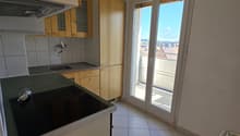 kitchen with appliances, countertop, sink, cabinets, balcony