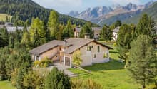 2 story house, brown roof, beige walls, garage, open front yard, scenic mountain view