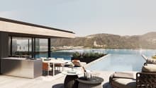 modern building, large terrace, kitchen island, large outdoor pool, dining table, lounge chairs, view of the lake