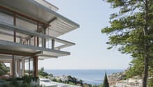 Modern house, concrete structure, glass windows, elevated position, sea view
