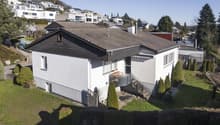single family house, 2 stories, white walls, gray roof, concrete stairs, balcony with railings