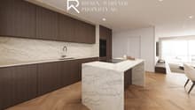 Central kitchen island, white marble countertops, dark wood cabinets, built-in appliances, hardwood flooring