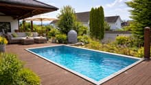 Wooden deck, swimming pool, outdoor sofa, umbrella, plants, trees