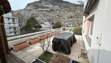 Outdoor space, covered terrace, green landscape, trees, mountains, covered table, wooden deck