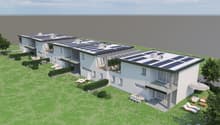 3 story apartment building, white exterior, solar panels on the roof, balconies, garden, outdoor seating