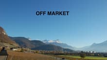 Beautiful view of vineyard fields, mountains, a town in the background