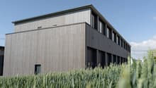 modern building, wood paneling, 2 stories, 2 garages