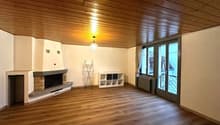 wooden floor, ceiling, white walls, fireplace, large windows, sliding door