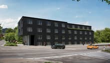 Modern architectural design, three-story residential building, large windows, entrance with awning, rooftop terrace
