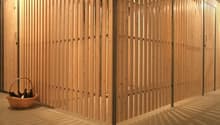 Wooden storage room with a basket filled with bottles