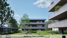 Modern multi-story apartment building with balconies, surrounded by lush greenery and trees. The building has a sleek, contemporary design with large windows and a mix of glass and dark exterior materials. There are people visible in the outdoor seating a