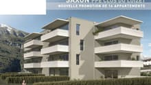 Modern apartment building with balconies, 3 floors, glass windows, greenery on balconies