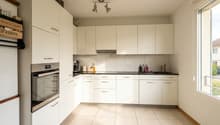 fully equipped kitchen, white cabinets, tiled floor, sink, faucet, coffee maker, dishwasher, oven