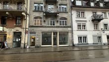 5 story building, balconies, stone exterior, windows, street front