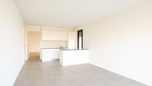 kitchen with countertop, cabinets, sink, faucet, and small balcony