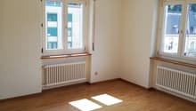 empty room, large windows, wooden floor, radiators