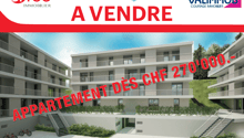 3-story apartment building with balconies, parking spaces, and landscaped outdoor areas