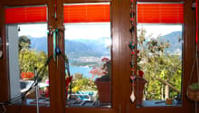 window, plants, decorative item, view to lake and mountain